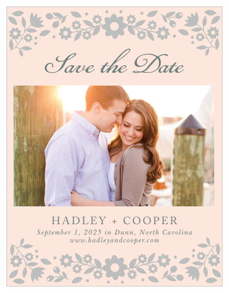 Delicate flowers accent the top and the bottom of the Floral Frame Foil Save-the-Date Cards.