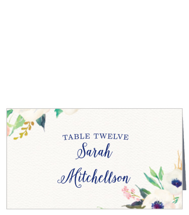 Watercolor florals splash at the corners of the Watercolor Anemone Place Cards giving. 