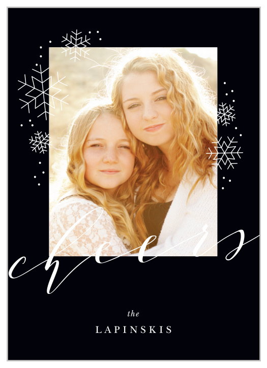 On the rich black background of our Charcoal Chic Holiday Cards, adorned with white snowflakes and two typefaces, is a gorgeous photo of your family.