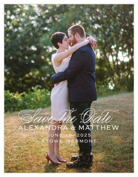 Floral Filigree Save-the-Date Magnets feature one of your beautiful engagement photos as their background, a typeface duo made up of a flowing script and modern marking, and delicate, ornate markings along the top and bottom borders in a classic bronze.