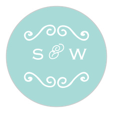 A chic, white, swirling accent and your initials sit atop a glass blue background for the Classy & Curly Wedding Stickers.