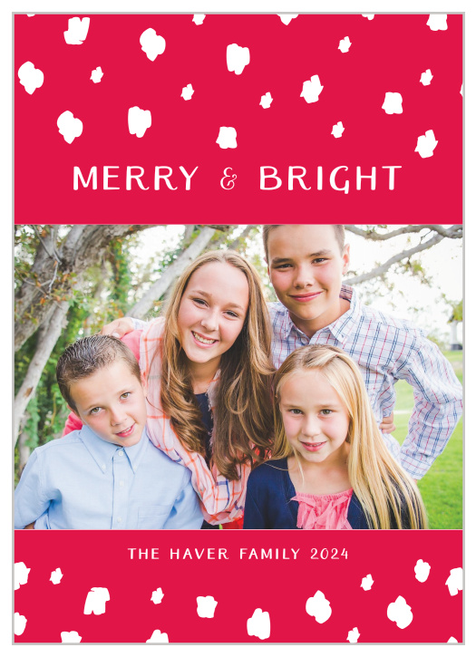 Festive, white confetti descends upon the Merry Confetti Photo Holiday Cards.