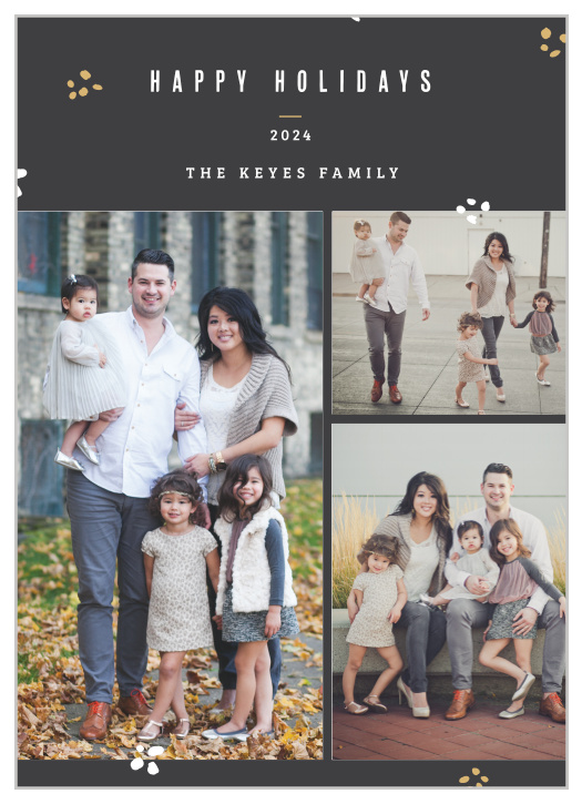 Decorated wth scattered bits of white and gold foiled confetti atop a stormy grey background.