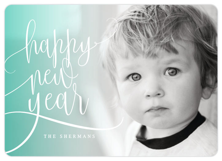 Flowing Script Photo Holiday Cards feature a trio of subtle cursive, cheerful coloring, and space for a lovely picture of your family.