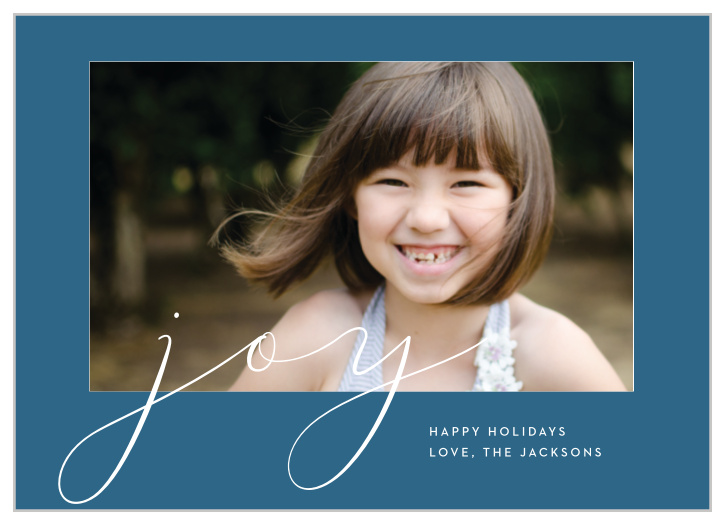 Thin, delicate, white lines sprawl across the surface of our Casual Script Photo Holiday Cards, spelling out the primary emotion of the season.