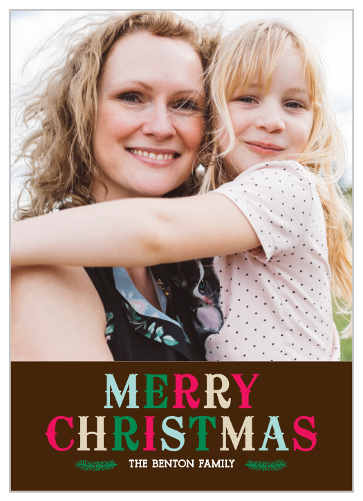 A large multi-colored heading in an old fashioned type is the main element of design on the Colorful Christmas Photo Christmas Cards set below your personalized photo.
