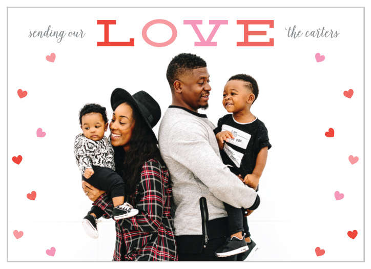 Your beautiful family is front and center on our Sending Love Valentine's Day Cards, surrounded by tiny hearts in various shades of pastel pink and red.