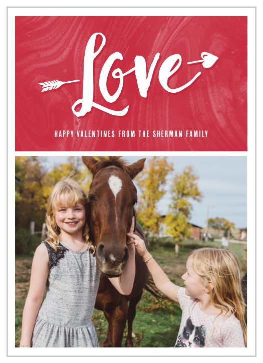 Our lovely Cupid Arrow Valentine's Day Cards are divided into two halves: the top features the word "Love" pierced by Cupid's arrow on a vibrant red background, while the bottom is a favorite family photo of your choice.