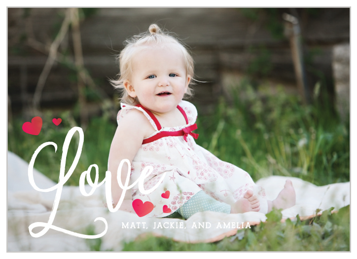The Blowing Kisses Valentine's Day Cards use your lovely photo combined with a white, scripted "love" and tiny ombre hearts to make the perfect card for this upcoming heart-day!