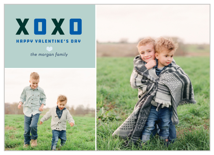 A boxy blue and black XOXO heads the trophy colored text area of the multi-photo Blue Heart Valentine's Day Cards. 
