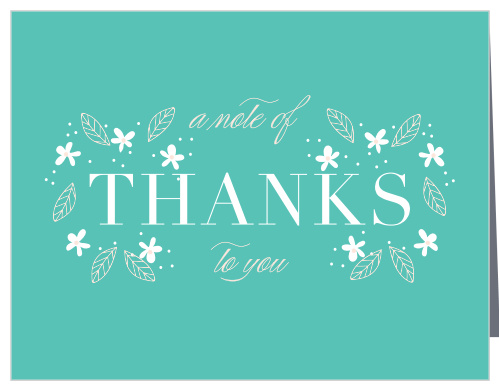 A deep aqua background is topped with darling floral decorations for our Baby's Breath Baby Shower Thank You Cards.