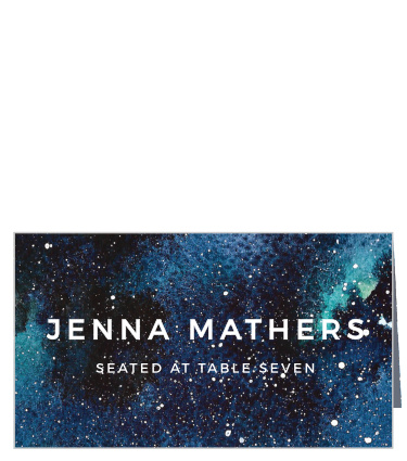 A stunning image of a bright and colorful, painted nebula serves as the backdrop for your guests' name and table number.