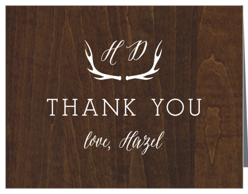 Express your deepest gratitude with our stunning Woodgrain Antlers Bridal Shower Thank You Cards. Rustic design elements serve to accentuate your message, spelled out in a large, bold print in the center of the card. With your initials hovering above in an elegant script, cradled by a set of antlers, these cards will doubtless be a gorgeous addition to your guests' homes.