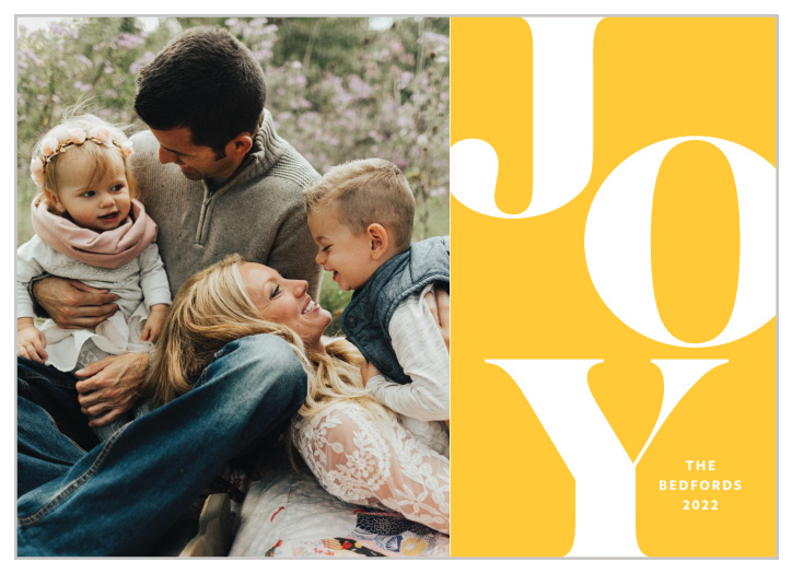 Spread the spirit of the holiday season with our Bold Sunshine Holiday Cards. With "joy" filling up most of the space on the right alongside your family name in stunning white, as well as your favorite family photo on the left, these will be cards your friends and family will not forget!