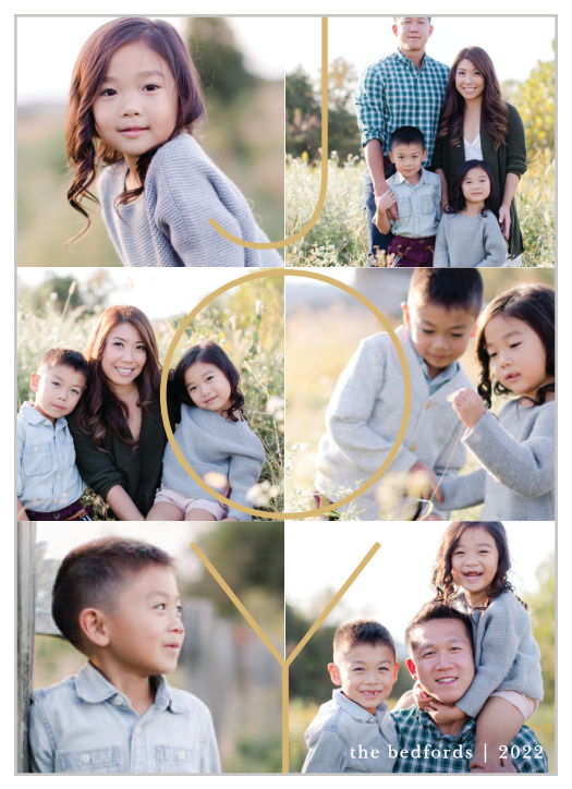 The Our Year Holiday Cards allow you to add 6 of your most cherished photos as the background of the design, topped by a thin-lined "JOY" in gold foil.