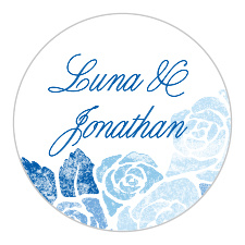 Decorate your wedding stationery and seal your envelopes with the unforgettable faded florals of our Mexican Flowers Wedding Sticker. Smooth calligraphy spells your own names in a shade of blue a few hues darker than the floral illustrations below, each deliberately time-worn for a vintage appearance.