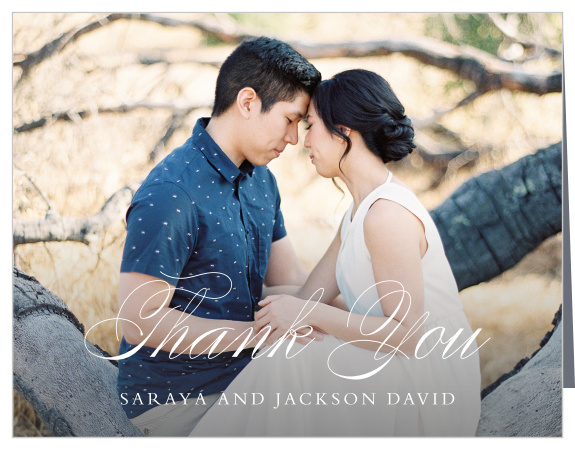 Our beautiful Rustic Ampersand Wedding Thank You Cards give you the style and space you need to share your appreciation with your guests once your wedding day has concluded. Your favorite engagement or wedding photo adorns the background, your names and brief message spelled out across the bottom in a duo of white typefaces. With plenty of space inside to personalize each card to each guest, you can be sure that your message hits them right in the feels.