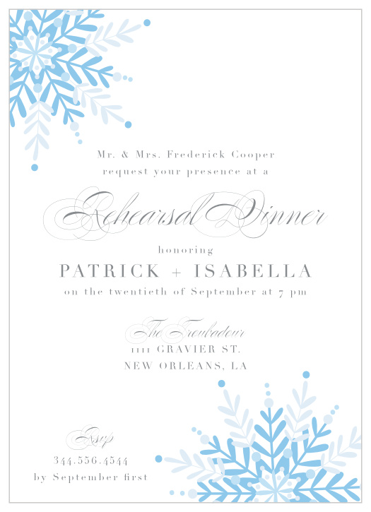 Two delicate snowflakes adorn the corners of our Winter Wonder Rehearsal Dinner Invitations.