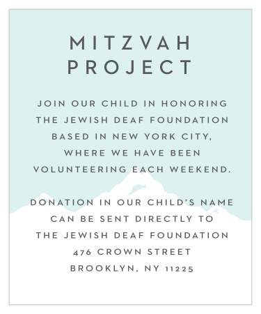 A snowcapped mountain is silhouetted against a light blue background on our Winter Skiing Bar Mitzvah Project Cards!
