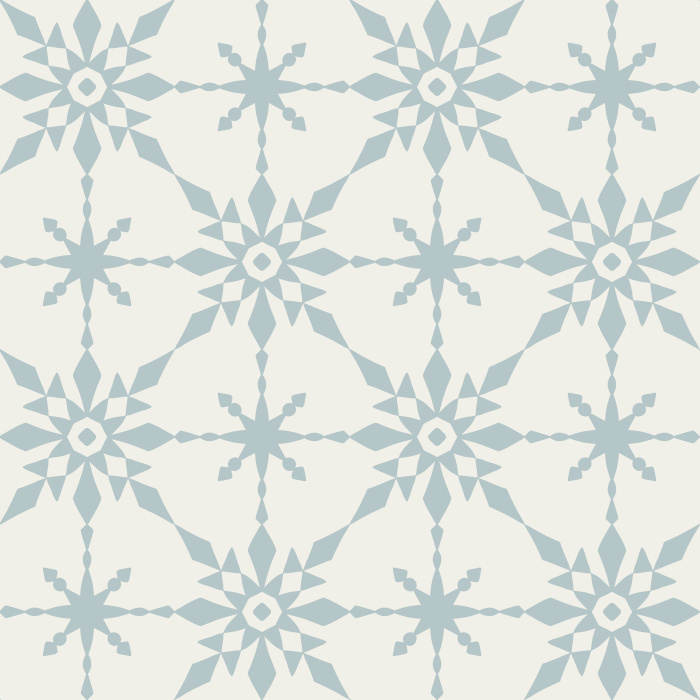 The Retro Quilt Wallpaper features a geometric floral star pattern in warm golden yellow on a soft cream background, inspired by mid-century quilt designs.