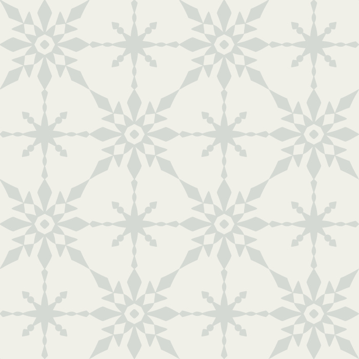 The Retro Quilt Wallpaper features a geometric floral star pattern in warm golden yellow on a soft cream background, inspired by mid-century quilt designs.