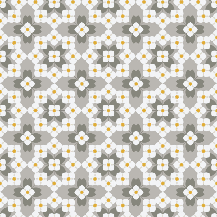 The Floral Quilt Wallpaper blends retro charm with cozy cottage warmth, featuring a geometric floral pattern in fresh shades of green and white with soft golden accents.