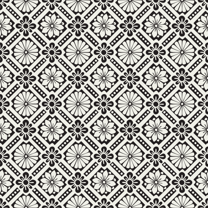Historic Blooms Wallpaper features a tile-inspired floral motif arranged in a bold geometric grid with navy, cream, and warm brown tones.