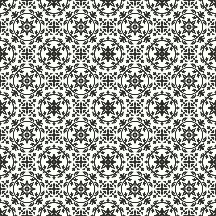 Vintage Trope Wallpaper features a delicate repeating floral medallion pattern inspired by antique tilework, heirloom textiles, and traditional European block prints.