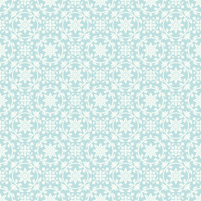 Vintage Trope Wallpaper features a delicate repeating floral medallion pattern inspired by antique tilework, heirloom textiles, and traditional European block prints.