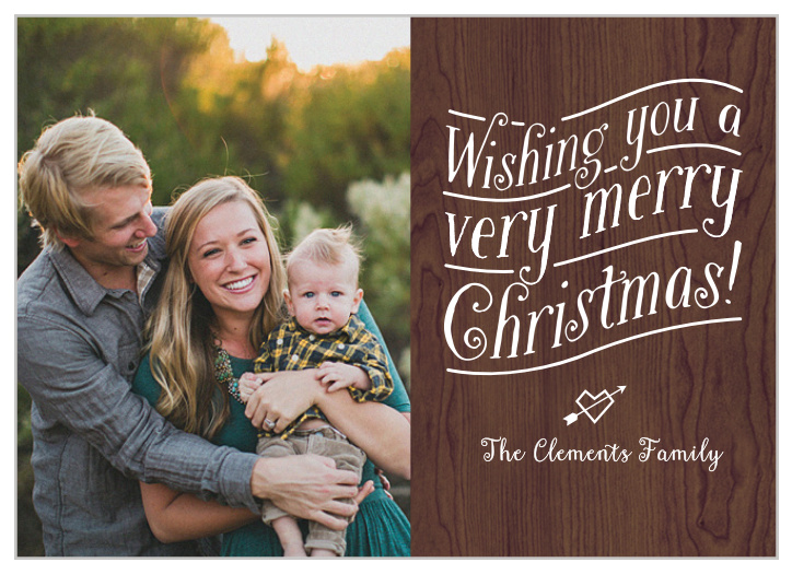 A rich wood texture with hand scripted text make this a romantic and cozy holiday card.