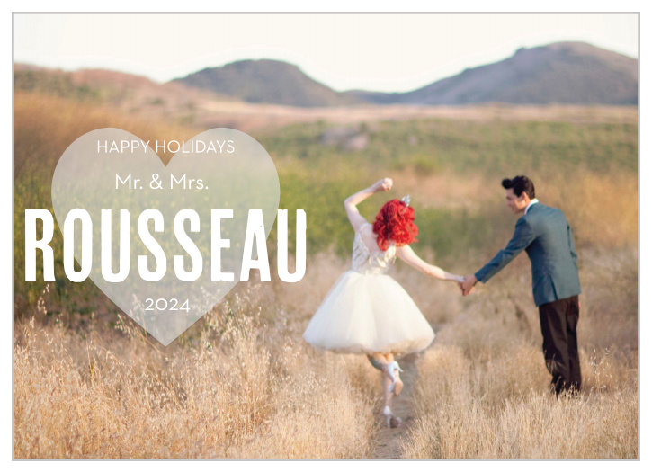 The Heart In Hand holiday card lets you use your photo as the background with a heart overlaid over the top where you can add your holiday greeting.