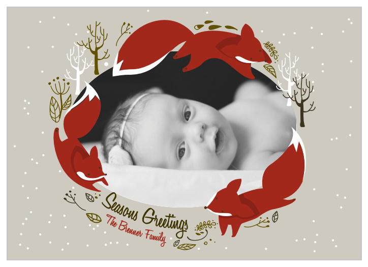 Our Foxy Wreath Holiday Cards feature illustrations of foxes and winter foliage that perfectly frame a photo of your choice.