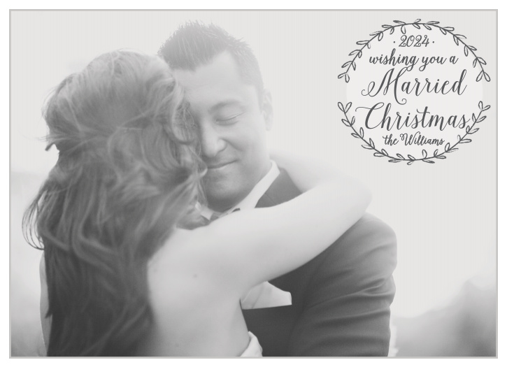 The Rustic Winter holiday card offers a full photo background with a leafy wreath that hold your holiday greeting.